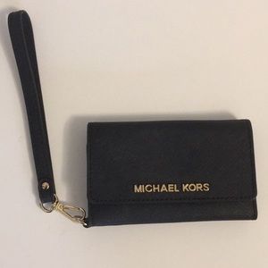 Michael Kors wristlet - built in phone holder.